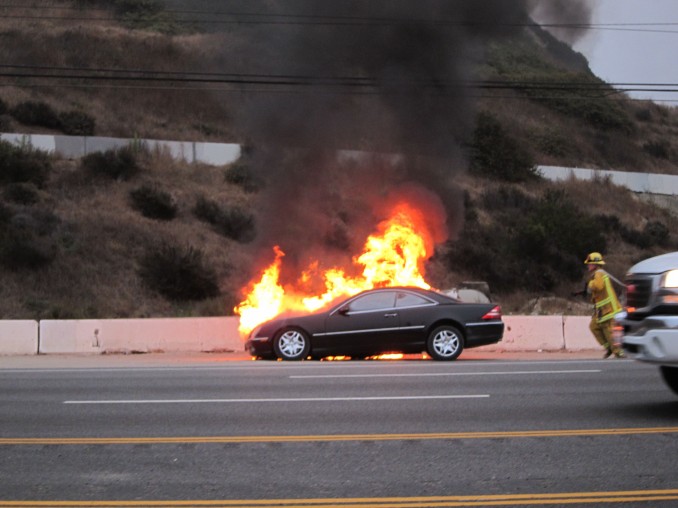 BURNING BENZ This is probably one of the best photos (of a pretty shitty situation for whomever was driving this benz) Ive ever been able to catch while driving. Almost crashed on the Pacific Coast Highway trying to get this fury but it was well worth it... I got the shot. Firefighters to the rescue in motion, priceless